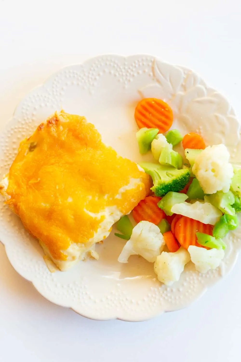 These chicken enchiladas are cozy, creamy, and always a crowd-pleaser. Made with canned chicken and topped with a homemade cheese sauce that has just a gentle hint of chili, they’re full of flavor without being too spicy for picky eaters. They’re also perfect for doubling up and freezing, which makes future dinners ridiculously easy.